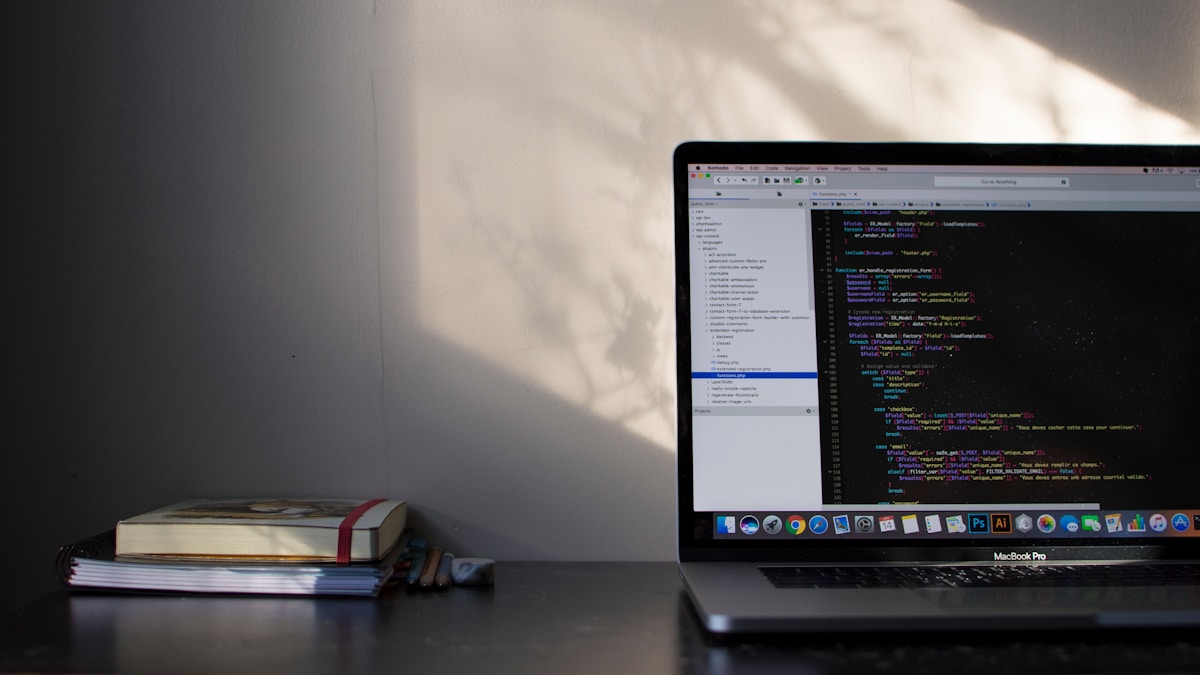 MacBook Pro showing programming language code